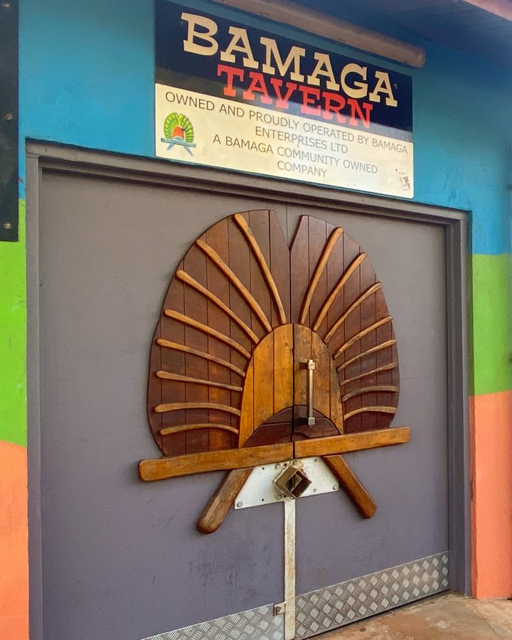 The door of the Bamaga Tavern is fashioned on a Torres Strait Islander Dhari headdress (Credit: Sarah Reid)