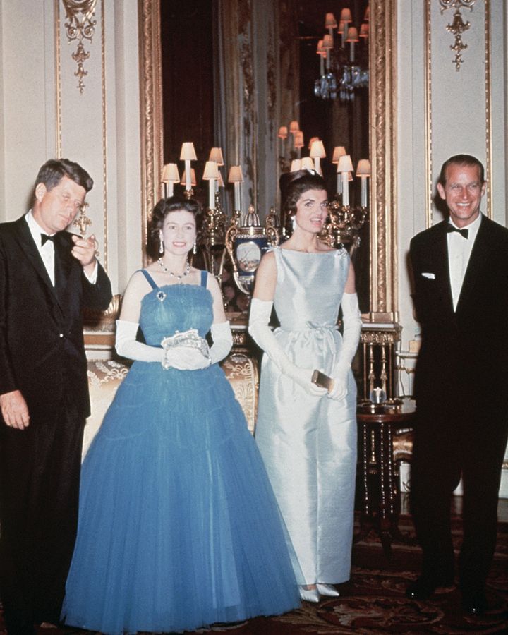 In 1961 the monarch hosted the Kennedys at Buckingham Palace wearing a pale-blue tulle gown – the encounter was dramatised in TV series The Crown (Credit: Getty Images)