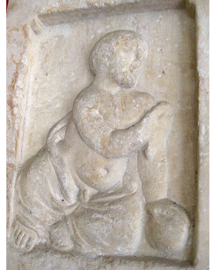 One Ancient Greek stelae shows a child sitting and playing with a ball (Credit: Maria Sommer/The National Museum of Athens/Hellenic Ministry of Education and Religious Affairs)
