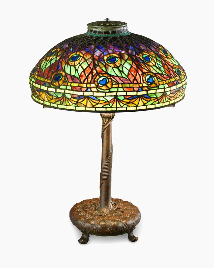 The Peacock table lamp, about 1905, was designed by Clara Driscoll for Tiffany Studios in New York (Credit: MMFA, Jean-François Brière)