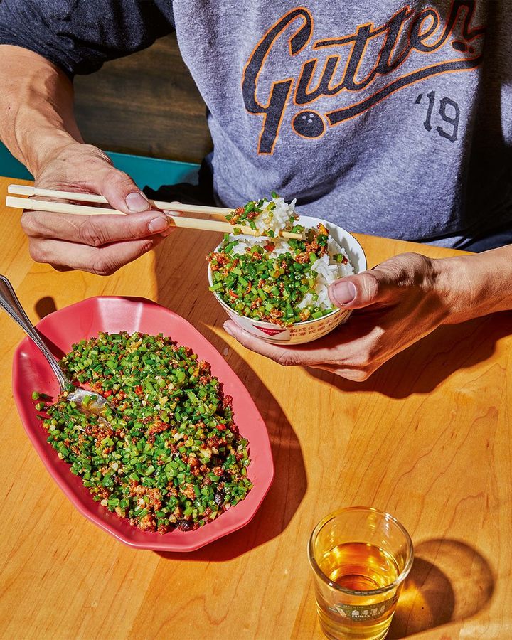 Flies' head" is a stir-fry of garlic chives and pork mince, with tiny bits of fermented black beans (Credit: Laura Murray)