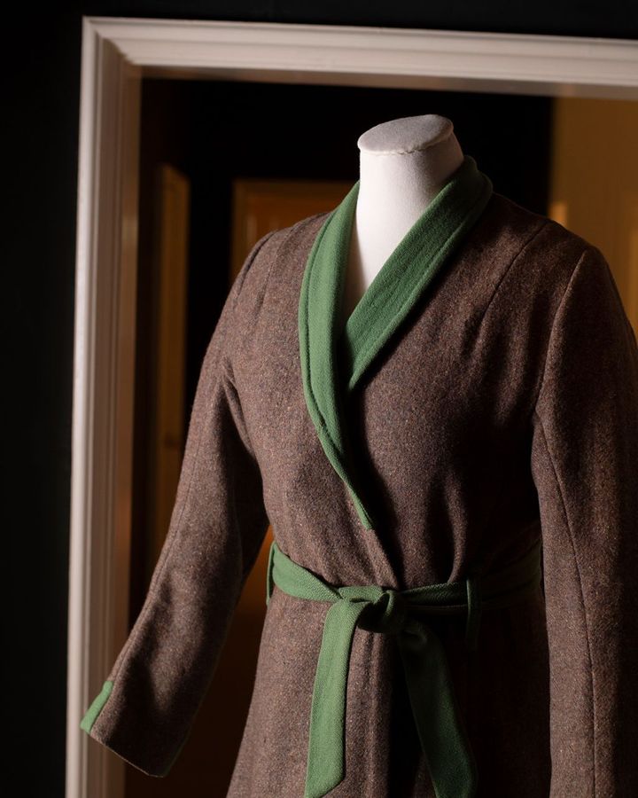 A woman's dressing gown made in the 1940s from a surplus World War Two army blanket and repurposed green woollen cloth (Credit: National Trust/ Steve Haywood)