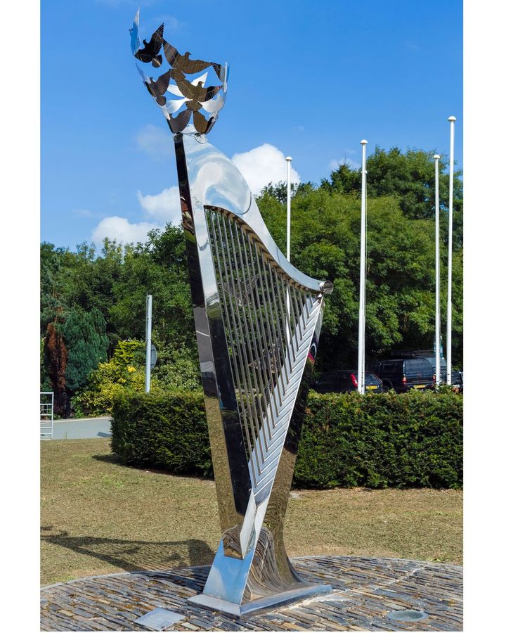 A harp sculpture stands outside the International Musical Eisteddfod site in Llangollen, Wales (Credit: Alamy)