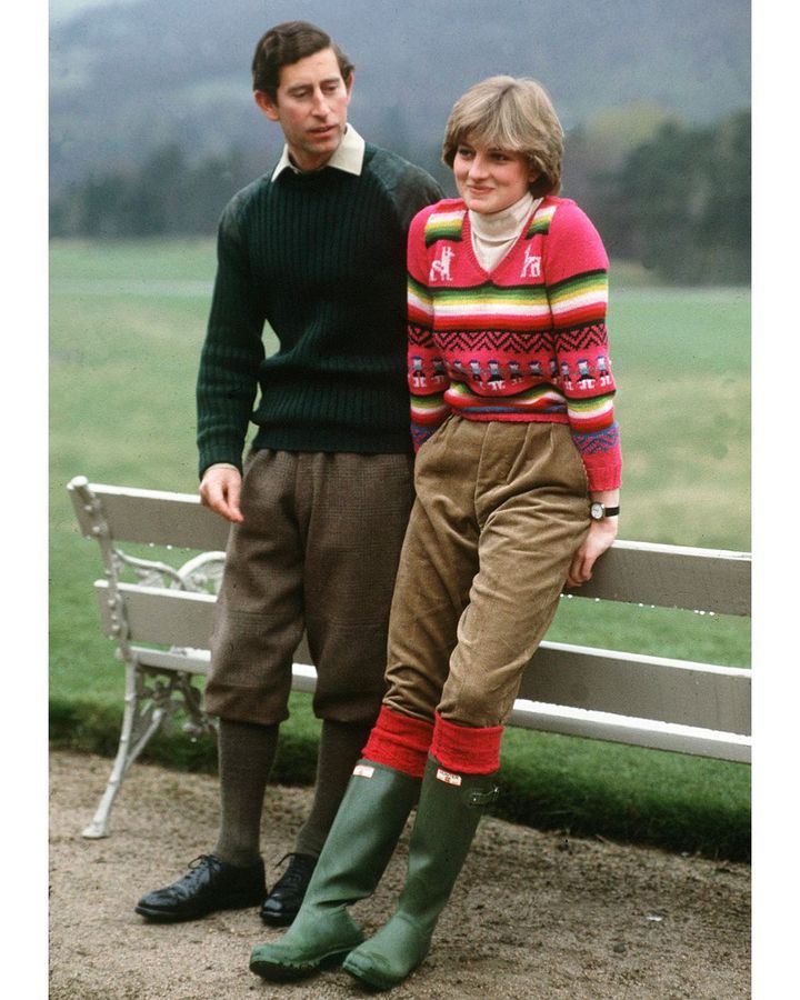 A pink jumper with a llama motif was another famous knitwear choice of Diana's – worn here with trousers tucked into classic Hunter wellies (Credit: Getty Images)