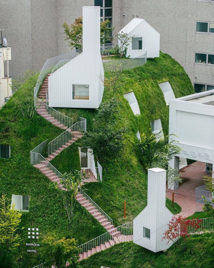 Shiroiya Hotel in Japan is built into the shell of a 300-year-old guesthouse, with an extension covered in a green hill that's a new urban space (Credit: Sou Fujimoto Architects)