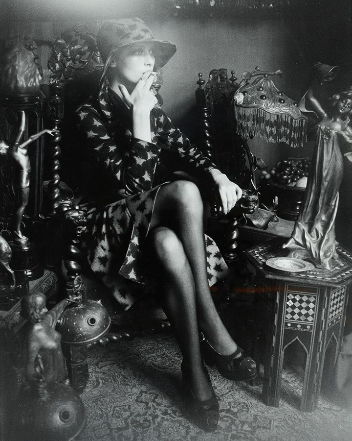 A model surrounded by Art Nouveau and Art Deco objects in the home of Barbara and her husband Fitz's home (Credit: Barbara Hulanicki Archive)