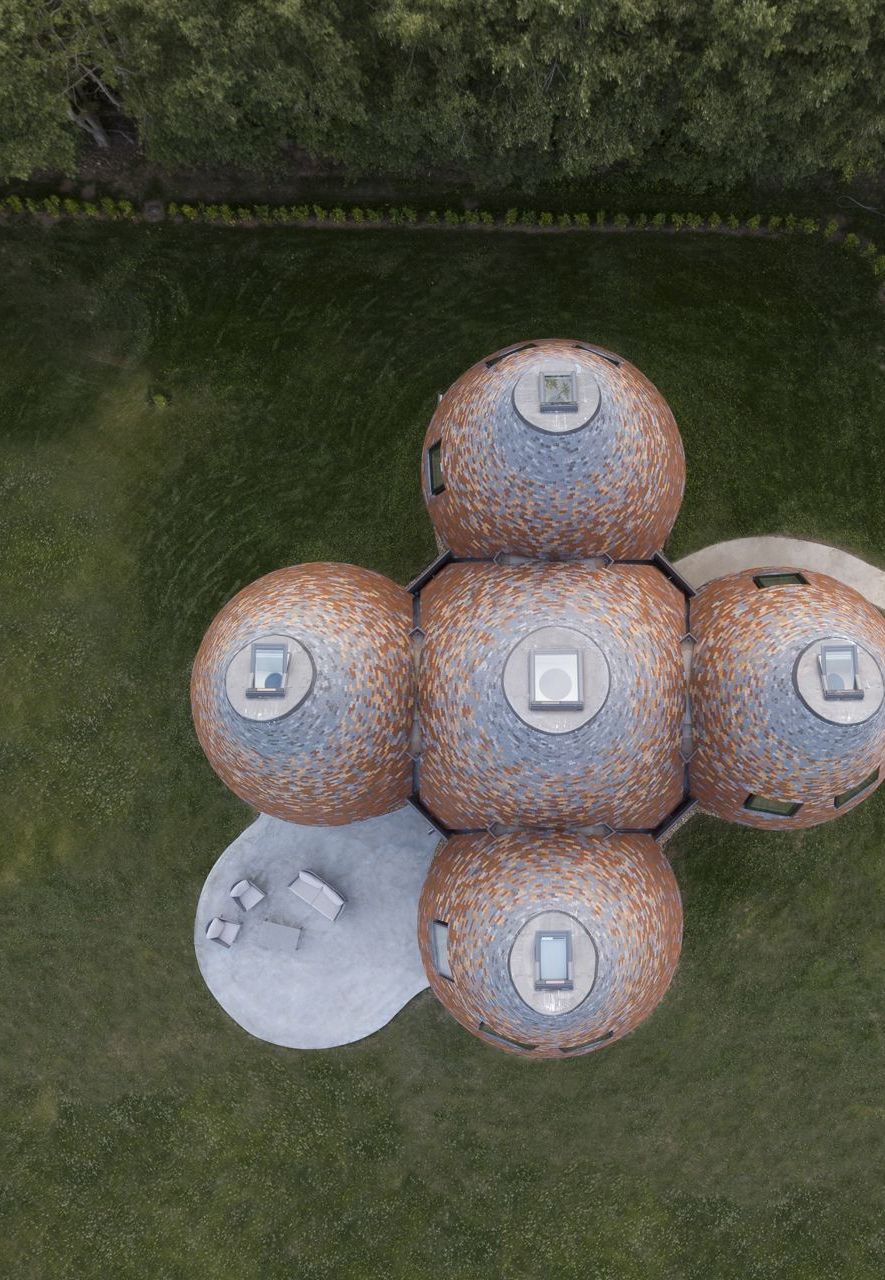 These contemporary conical buildings by ACME in the UK, seen here from above, are inspired by oast houses (Credit: Jim Stephenson)