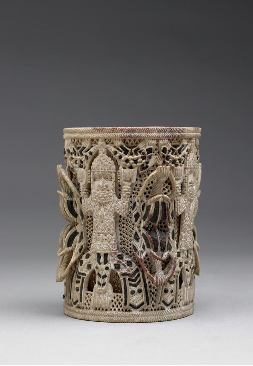 An ivory armlet depicts the Oba (king) of the African kingdom of Benin with symbolic mudfish legs (Credit: British Museum)