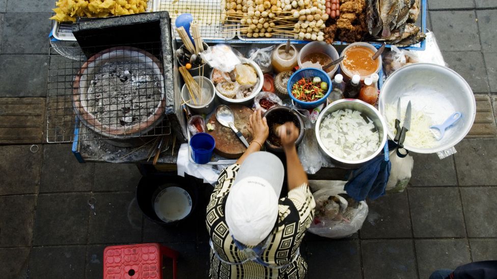 A street food vendor prepares his wares for the classic Bangkok eating experience. (Ray Laskowitz/LPI)