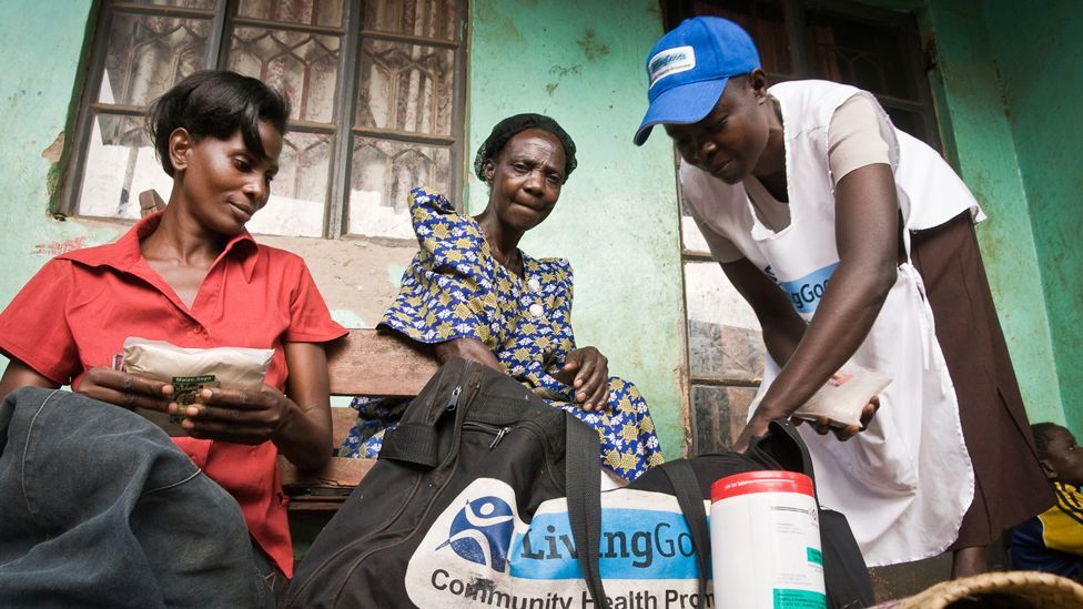 Gertrude shows customers some of her items for sale in Tule, a slum in Kampala. She sells goods such as nappies and de-worming pills. Gertrude shows customers some of her items for sale in Tule, a slum in Kampala. She sells goods such as nappies and de-worming pills.