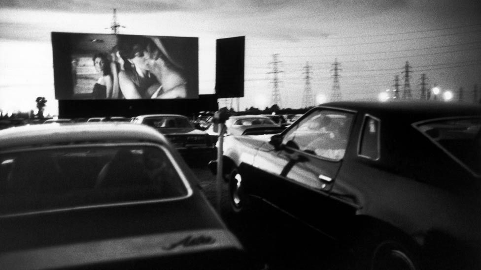 A Montreal ‘cine-park’ in 1982. Ardour on screen was echoed in the cars’ backseats –and drive-ins became known as ‘passion pits’. (Photo: Guy Le Querrec/Magnum Photos)