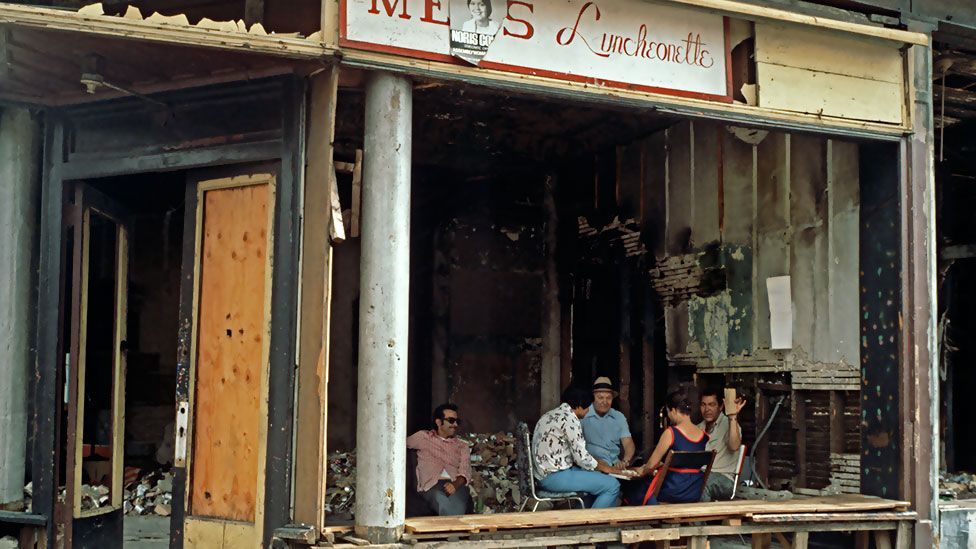 Card players in a fire-bombed shop. The Bronx experienced a sustained period of urban decay and an epidemic of arson in the 1970s. (Photo: Corbis) Card players in a fire-bombed shop. The Bronx experienced a sustained period of urban decay and an epidemic of arson in the 1970s. (Photo: Corbis)