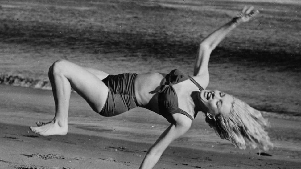 Marilyn Monroe frolicking on the beach near her Hollywood home during a break from filming in 1950. (Getty)