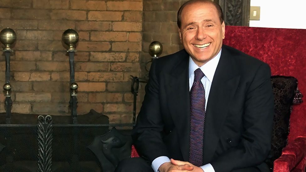 Wearing a one-piece navy suit while posing in Villa Madama, his official residence in Rome in 2002. Berlusconi has always been a meticulous dresser. (Getty Images)