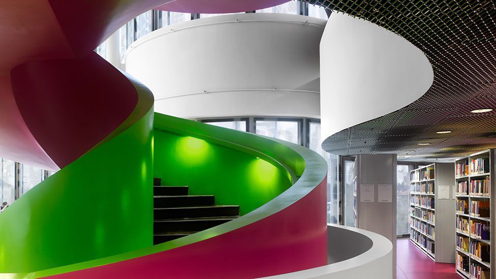 A brightly coloured concrete staircase winds its way through the library of the Brandenburg Technical University in Cottbus, Germany. A brightly coloured concrete staircase winds its way through the library of the Brandenburg Technical University in Cottbus, Germany.