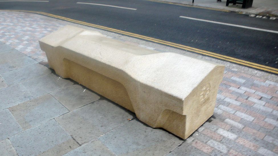 This bench in Camden, London has a ridged top to prevent rough sleeping. It also has no alcoves, which its makers claim discourages the hiding of drugs. (Sam Jacob)