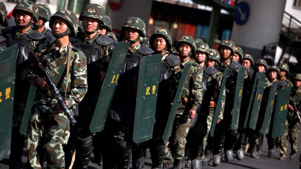 State security policing Urumqi in Xinjiang province during the 2009 riots. (Corbis)