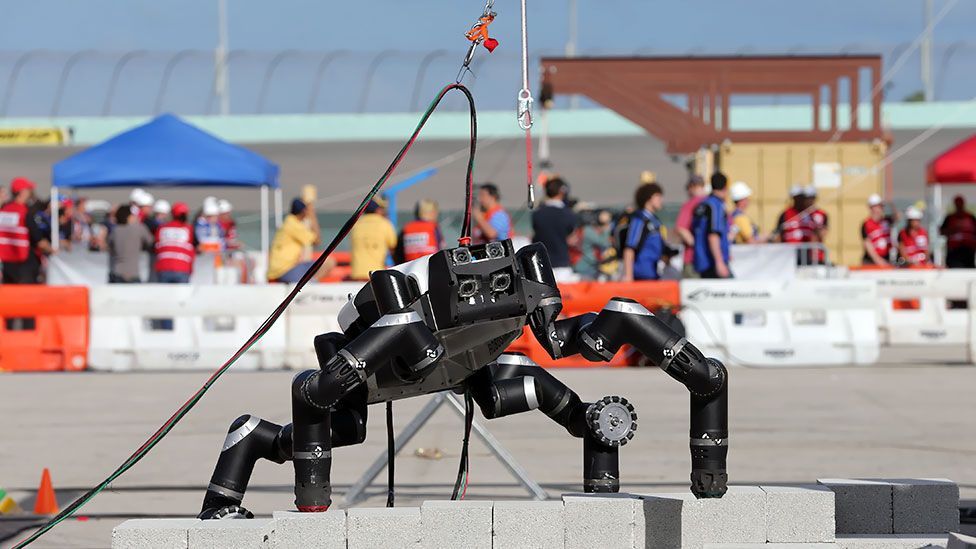 RoboSimian, from the Nasa Jet Propulsion Laboratory, tackles a wall-climbing challenge at the Homestead-Miami Speedway, as part of a multinational robotics competition. (AP) RoboSimian, from the Nasa Jet Propulsion Laboratory, tackles a wall-climbing challenge at the Homestead-Miami Speedway, as part of a multinational robotics competition. (AP)