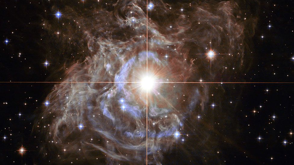 RS Puppis, a Cepheid variable star, captured by the Hubble Space Telescope. The star’s brightness varies, and it sits surrounded in a massive dust cloud. (ESA/Nasa/Hubble) RS Puppis, a Cepheid variable star, captured by the Hubble Space Telescope. The star’s brightness varies, and it sits surrounded in a massive dust cloud. (ESA/Nasa/Hubble)