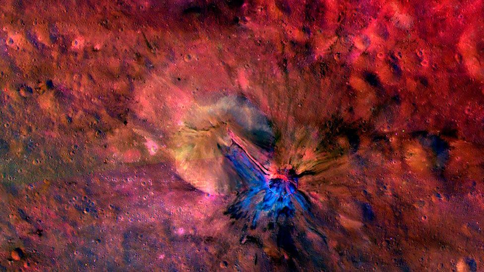 The flow of debris in and out of a crater on the giant asteroid Vesta is shown in a composite image from Nasa’s Jet Propulsion Laboratory. (Nasa/JPL-Caltech/UCLAMPS/DLR/IDA) The flow of debris in and out of a crater on the giant asteroid Vesta is shown in a composite image from Nasa’s Jet Propulsion Laboratory. (Nasa/JPL-Caltech/UCLAMPS/DLR/IDA)