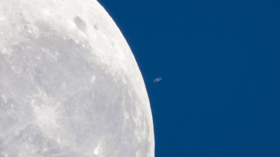 Saturn seems tiny next to our Moon as it passes in front of the planet – an event known as an occultation. (Colin Legg) Saturn seems tiny next to our Moon as it passes in front of the planet – an event known as an occultation. (Colin Legg)