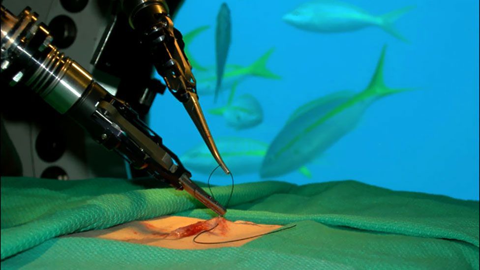A robot simulates stitches on an underwater base, while being controlled by surgeon Mehran Anvari from the surface (David Williams)