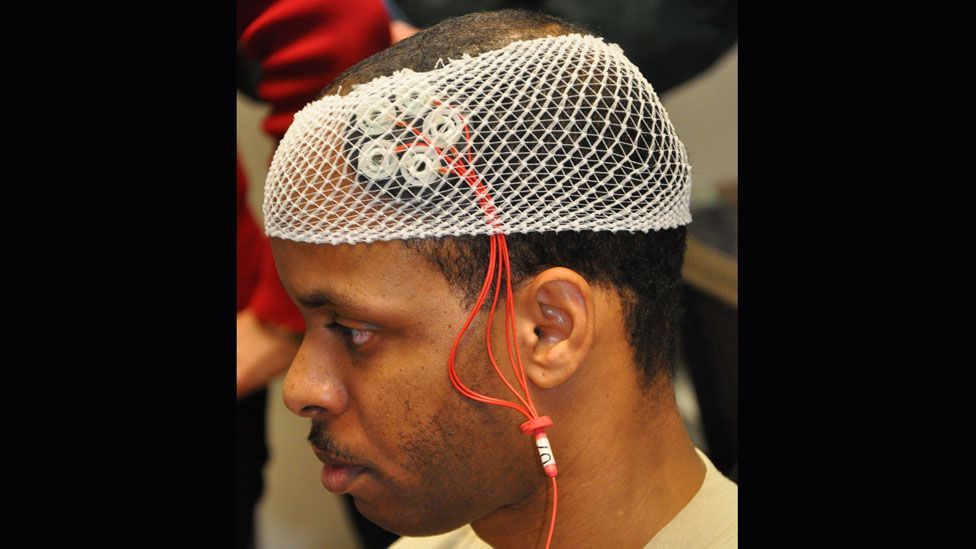 An airman at Wright-Patterson Air Force Base takes part in a brain stimulation trial (Michele Eaton/88 Air Base Wing Public Affairs)