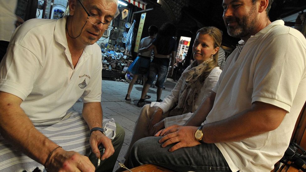 Bosnians share coffee in downtown Sarajevo. (Elvis Barukcic/AFP/Getty)