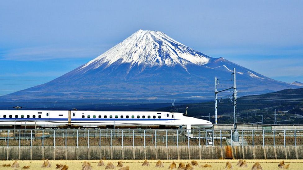 A bullet train speeds past a majestic Mount Fuji in Japan (Sean Pavone/Alamy) A bullet train speeds past a majestic Mount Fuji in Japan (Sean Pavone/Alamy)