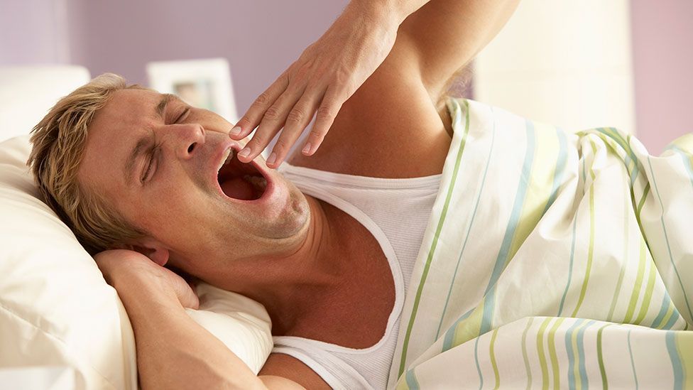 Does infectious yawning ensure that we all go to bed at the same time? (Getty Images)
