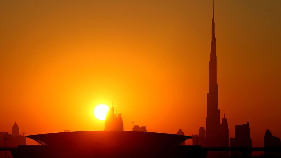 A sunset silhouettes Dubai's Burj Khalifa, the world's tallest tower and one of the city's main attractions. (Marwan Naamani/AFP/Getty)