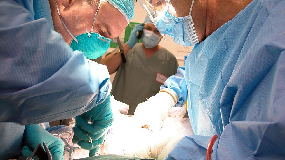 Surgeons prepare a body for ‘perfusion’ of a solution that prevents ice formation in tissue (Courtesy of Alcor Life Extension Foundation)