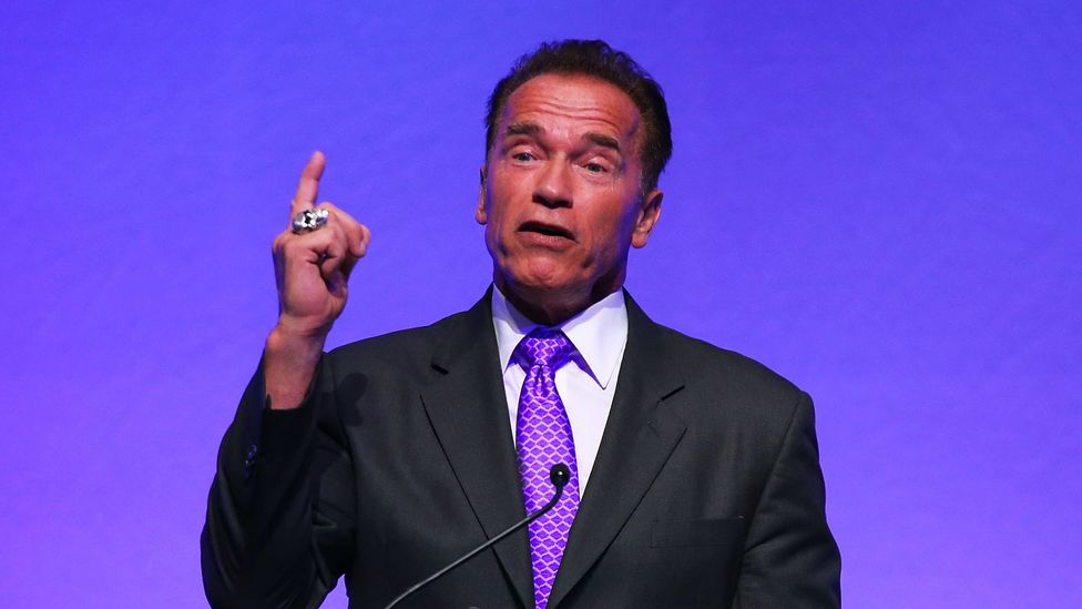 Arnold Schwarzenegger shows self confidence by wearing purple. (Getty Images)
