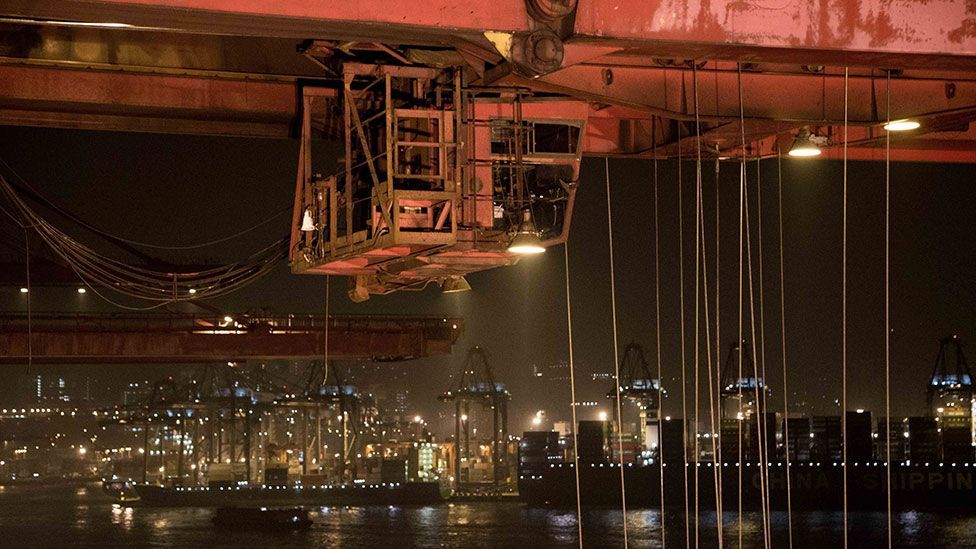 Giant cranes load ships in Hong Kong (Kate Davies/Unknown Fields) Giant cranes load ships in Hong Kong (Kate Davies/Unknown Fields)