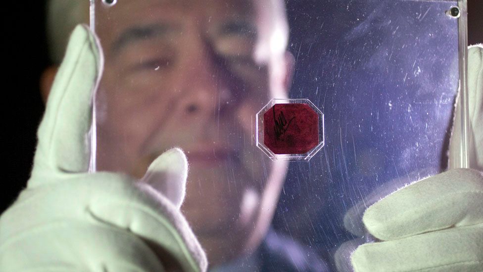 The British Guiana one-cent magenta, an octagon postage stamp released in 1856, fetched a record $9.5m at auction in 2014. (Credit: Oli Scarff/Getty Images) The British Guiana one-cent magenta, an octagon postage stamp released in 1856, fetched a record $9.5m at auction in 2014. (Credit: Oli Scarff/Getty Images)