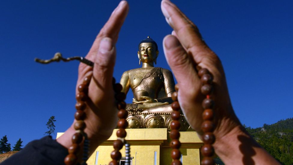 A devotee before the Buddha Dordenma statue in Thimphu. (Credit: Prakesh Mathema/AFP/Getty)