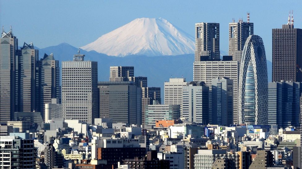 Mount Fuji’s symmetric cone serves as a dramatic backdrop to Tokyo (Credit: Getty Images)