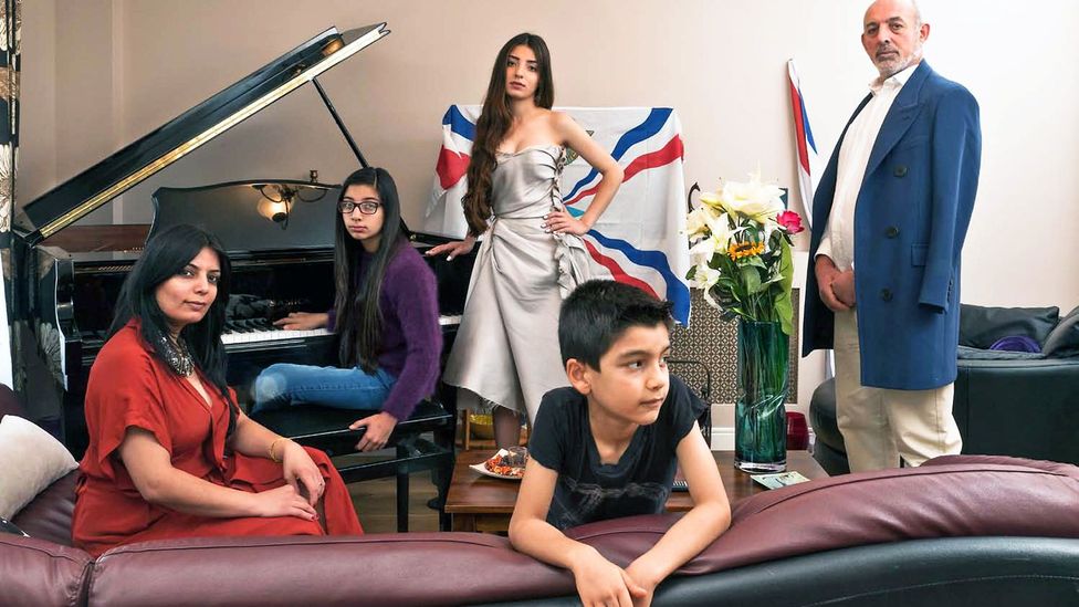 Nahrin David, from Syria, and her husband Samir, from Iraq, with their children Ninweh (at the piano), Noora and Nishra'd Atour (Credit: Chris Steele-Perkins/Magnum Photos)
