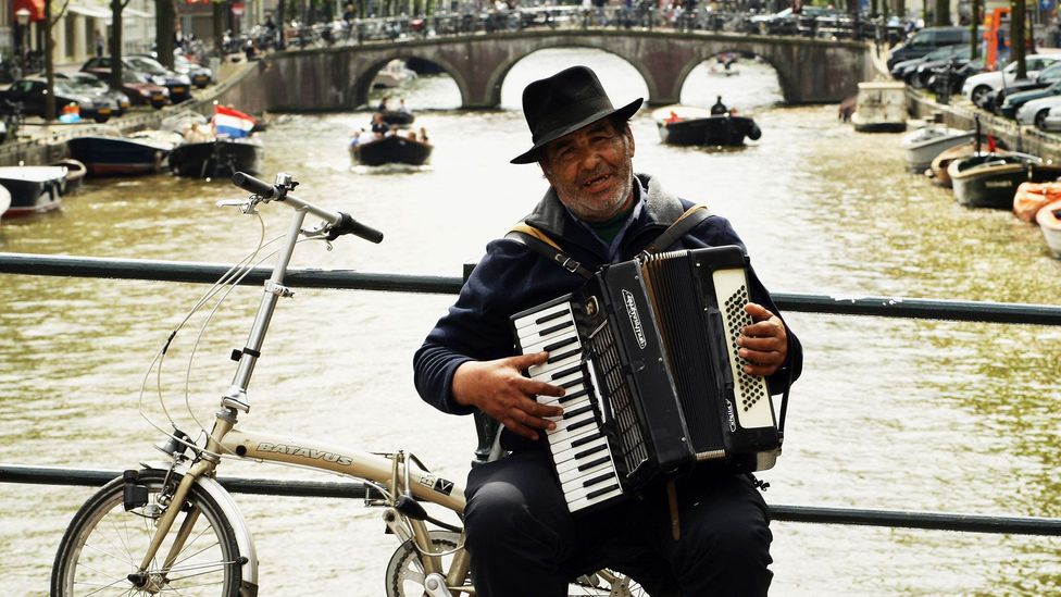 A busker performs from his bicycle in Amsterdam (Credit: Mark Dadswell/Getty) A busker performs from his bicycle in Amsterdam (Credit: Mark Dadswell/Getty)