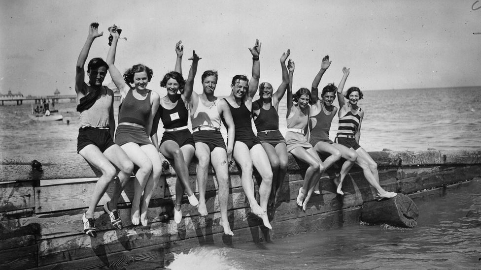 Tourists once flocked to Britain’s seaside towns – like these vacationers in Eastbourne in 1930 (Credit: WG Phillips/Getty Images)