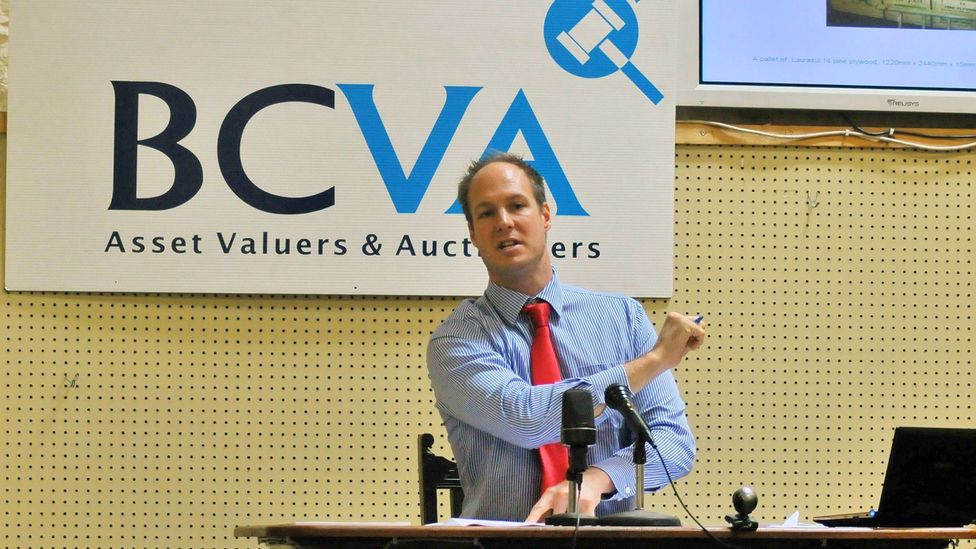 Sam Ewing auctions off suitcases at Bristol Commercial Valuers and Auctioneers (Credit: Brendan Cole)