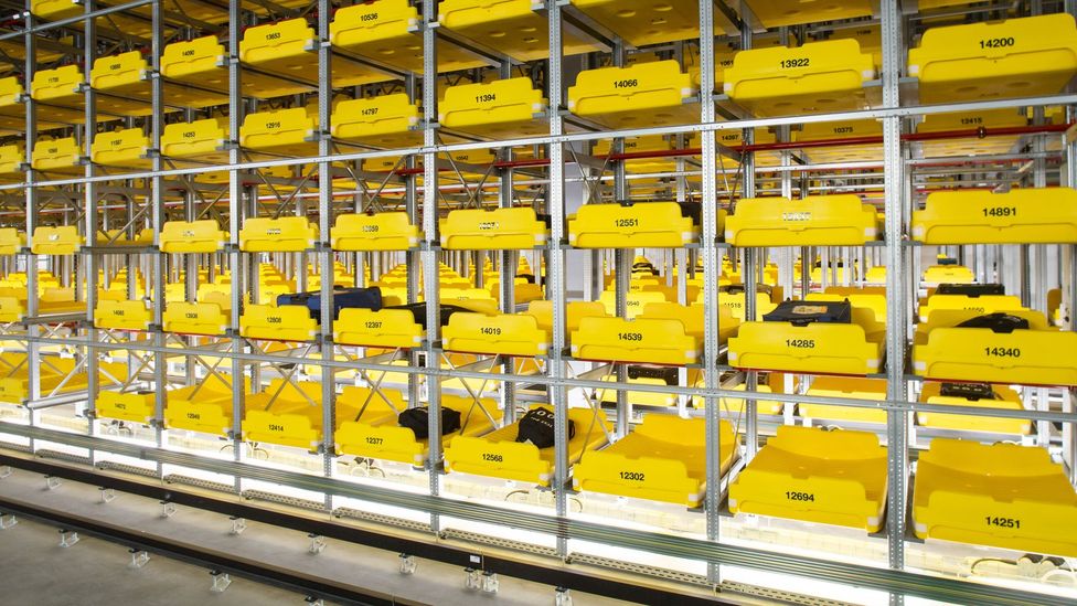 The uniform yellow crates also have ID which keep track of what luggage is on them (Credit: Heathrow Airport)