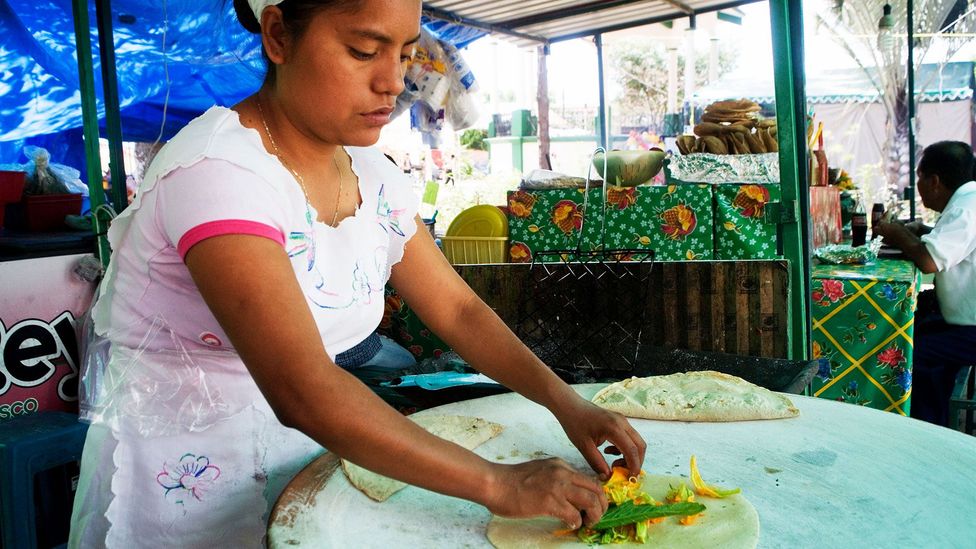 Preparing tortillas filled with calabaza flowers (Credit: Liba Taylor/Alamy) Preparing tortillas filled with calabaza flowers (Credit: Liba Taylor/Alamy)