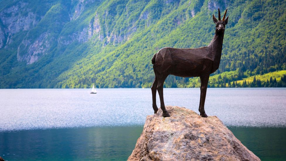 The Zlatorog, or Golden Horn, statue guards the shores of Lake Bohinj (Credit: Ken Welsh/Alamy)