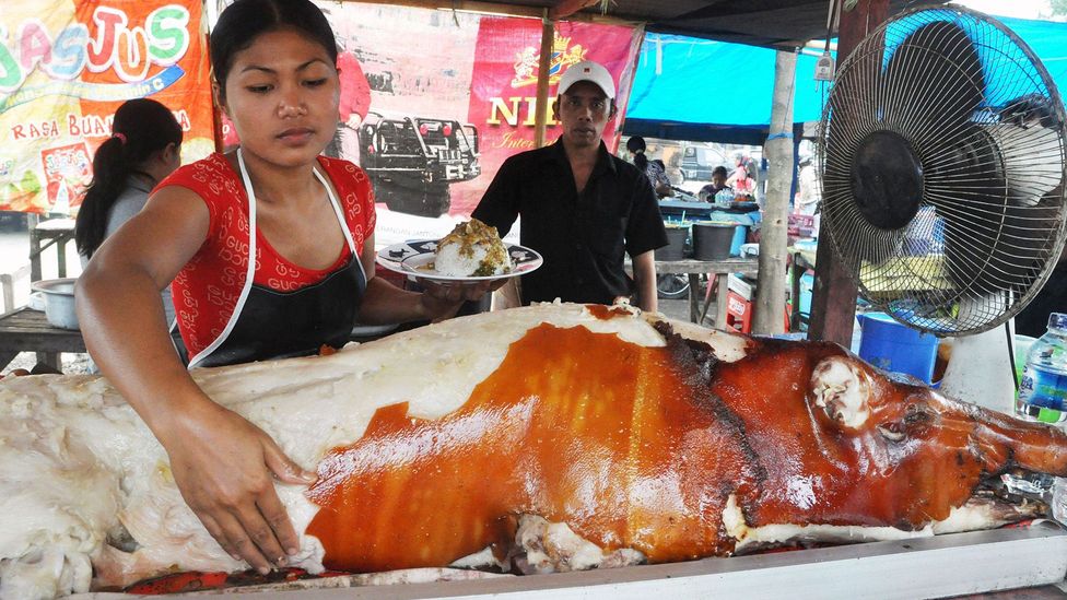 The roasted pig’s golden brown skin chips off like paint (Credit: age fotostock/Alamy)