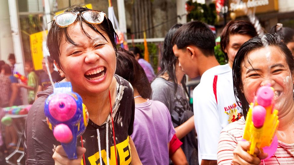 Stepping outside on Songkran means getting drenched by water pistols (Credit: Jack Kurtz/Getty)