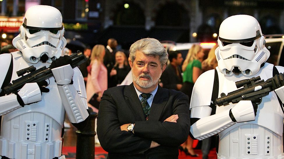 George Lucas, flanked by storm troopers. (Credit: Getty Images)
