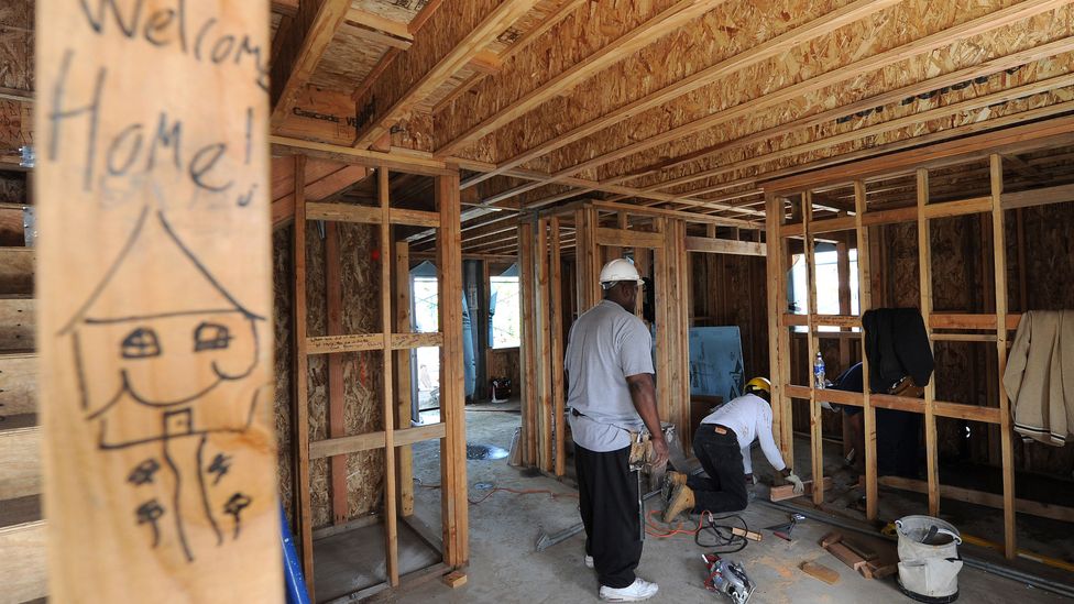 Nonprofit, Habitat for Humanity volunteers build environmentally friendly homes for low-income families in Lynwood, California. (Credit: Getty Images/AFP)
