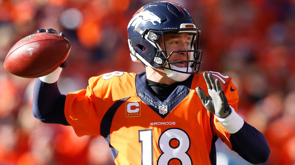 Denver Broncos, Peyton Manning, looks to pass against the New England Patriots. (Credit: Getty Images)