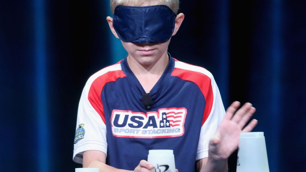 Austin Naber is able to stack cups without his conscious mind really registering the task (Credit: Getty Images) Austin Naber is able to stack cups without his conscious mind really registering the task (Credit: Getty Images)